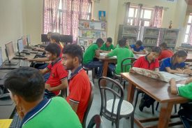 STUDENTS STUDYING IN LIBRARY