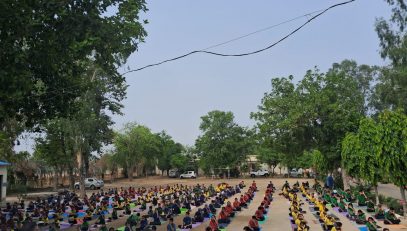 STUDENTS PERFORMING YOGA