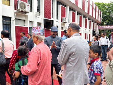 Students and Parents Receiving Sweets