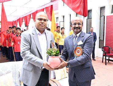 Principal Presenting Sapling to Chairman VMC