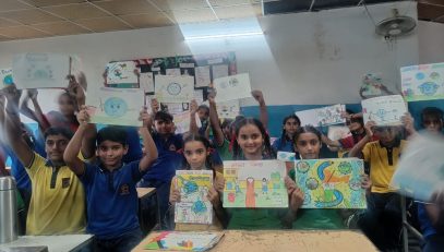 students showing posters made by them