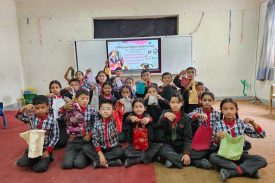 Primary students demonstrating cloth bag